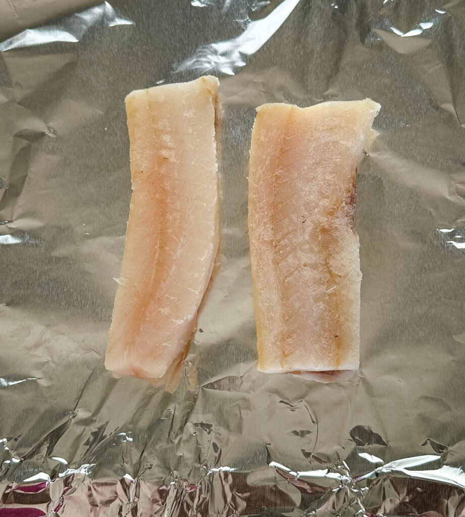 raw cod on a piece of foil