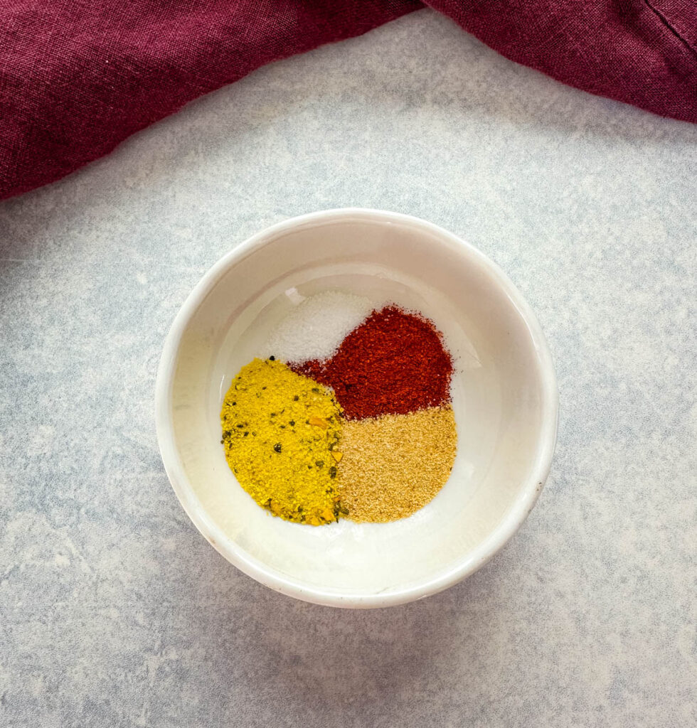 lemon pepper, smoked paprika, garlic powder, and salt in a white bowl