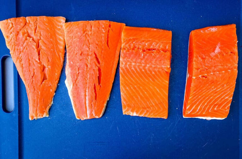 raw salmon on a cutting board