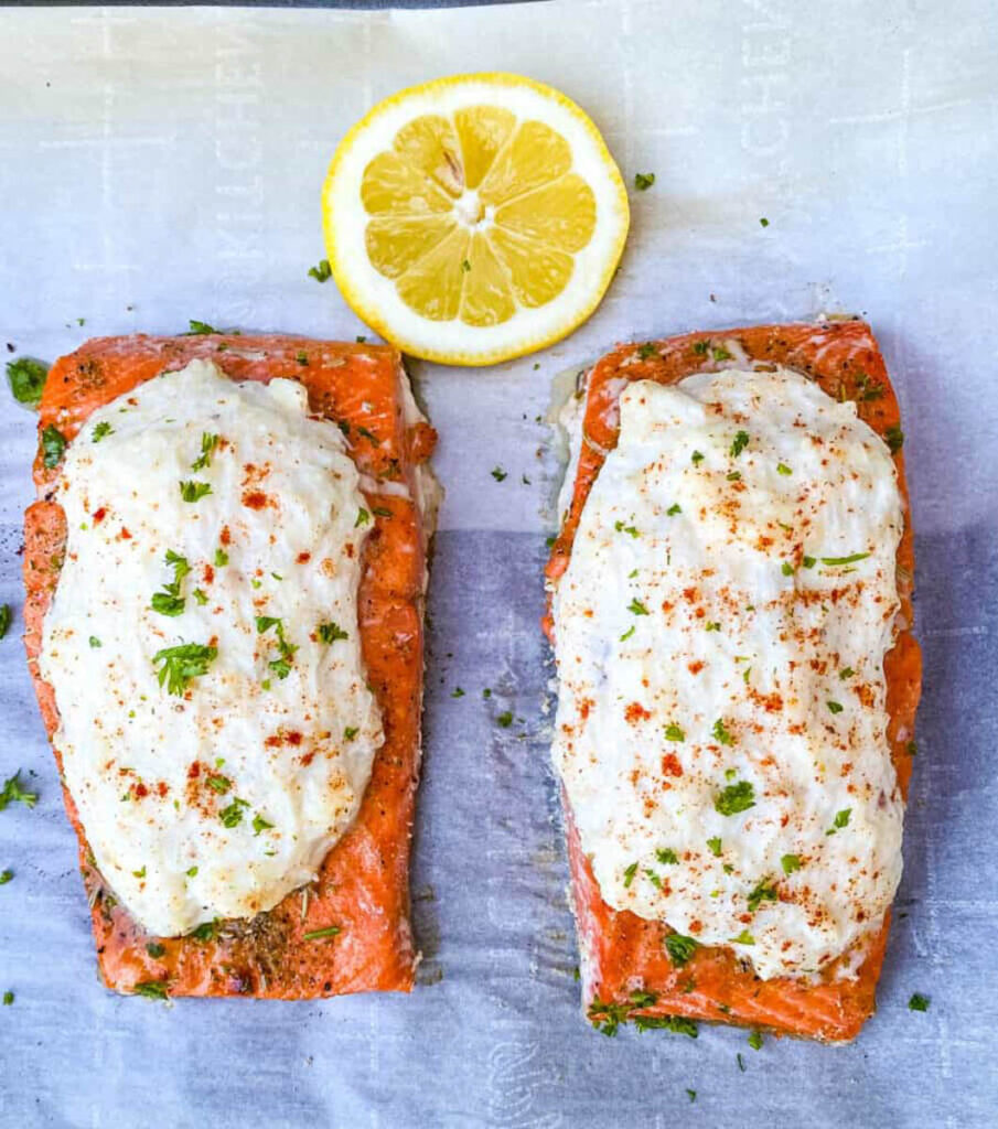 baked salmon stuffed with real crab meat on parchment paper