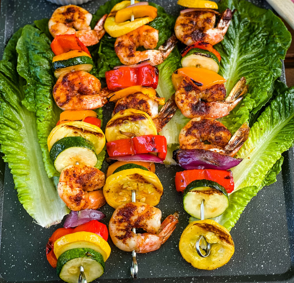 grilled shrimp kebabs on romaine lettuce