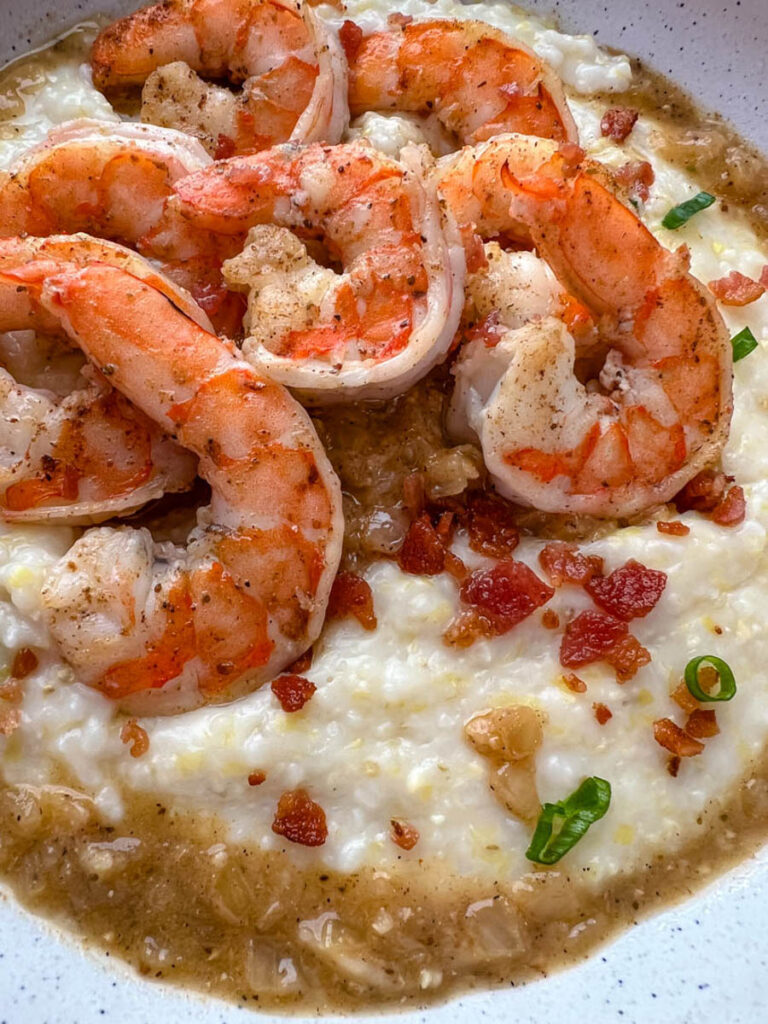 shrimp, grits, and bacon in a bowl