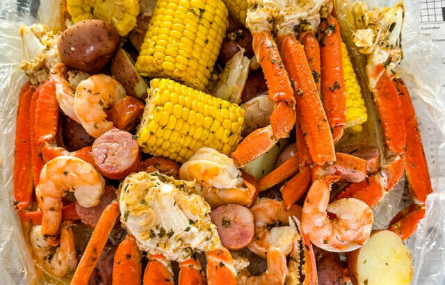 seafood boil in a bag wih snow crab clusters, shrimp, potatoes, corn on the cob and sausage