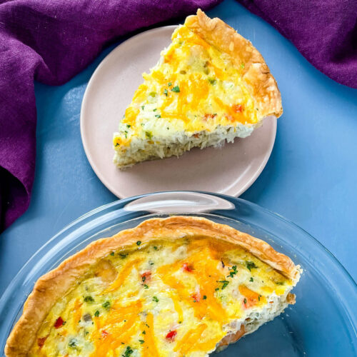 crab quiche with cheese in a glass pie plate
