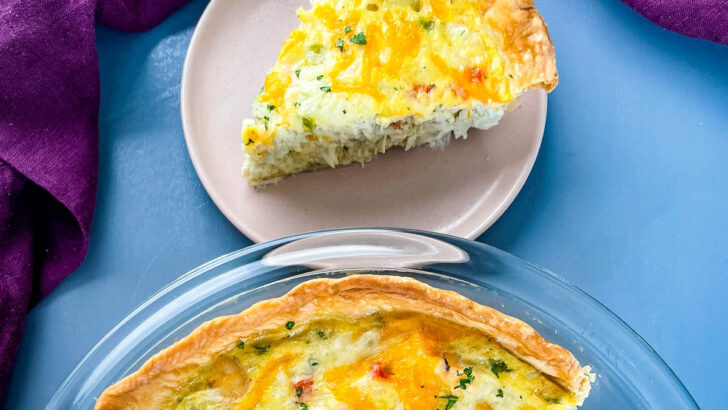 crab quiche with cheese in a glass pie plate