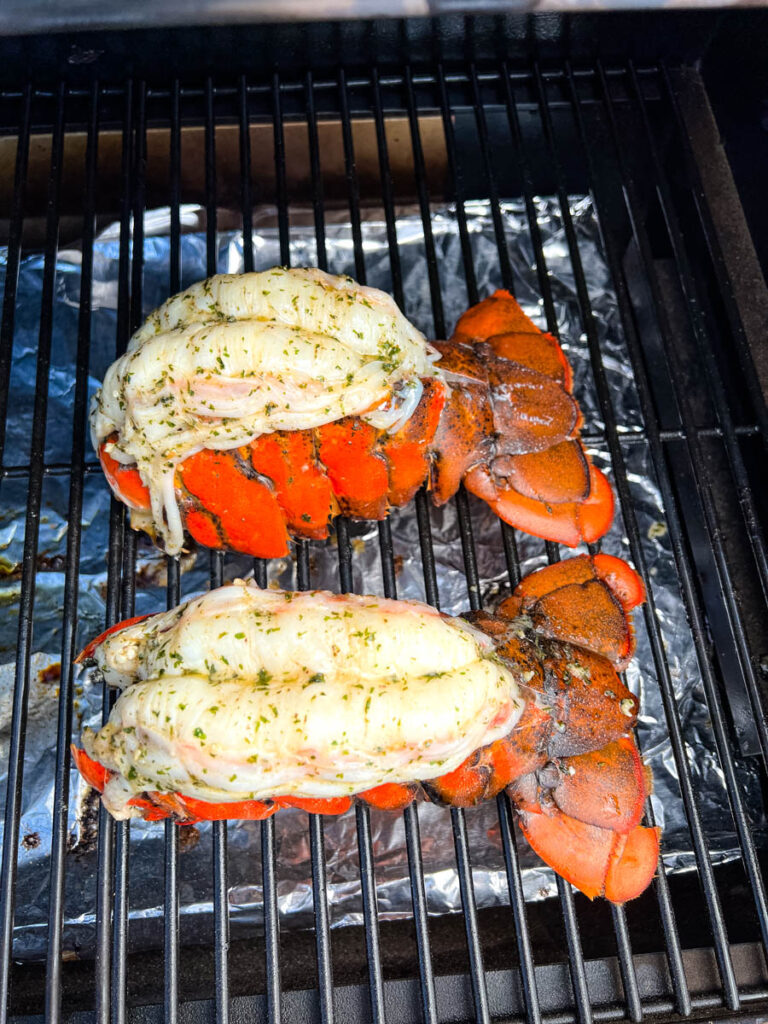 smoked lobster tails with garlic butter on a Traeger smoker