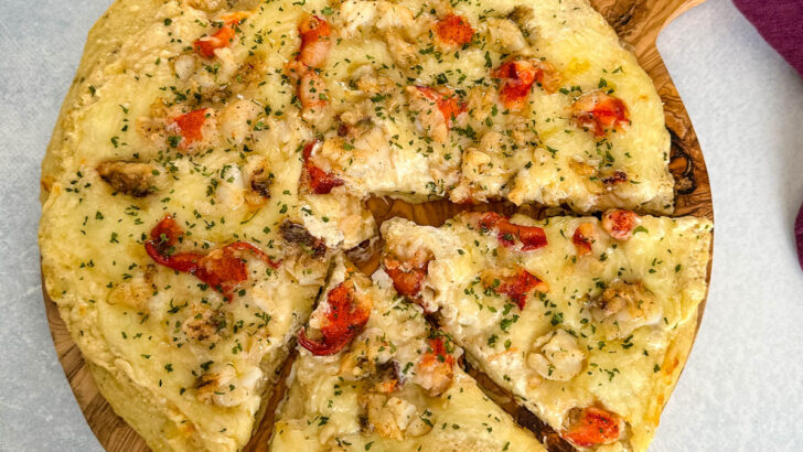 baked lobster pizza on a flat surface