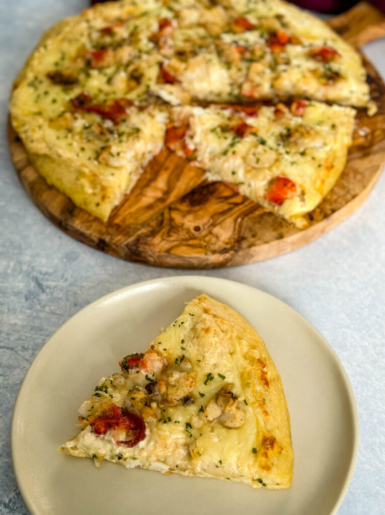 baked lobster pizza on a plate