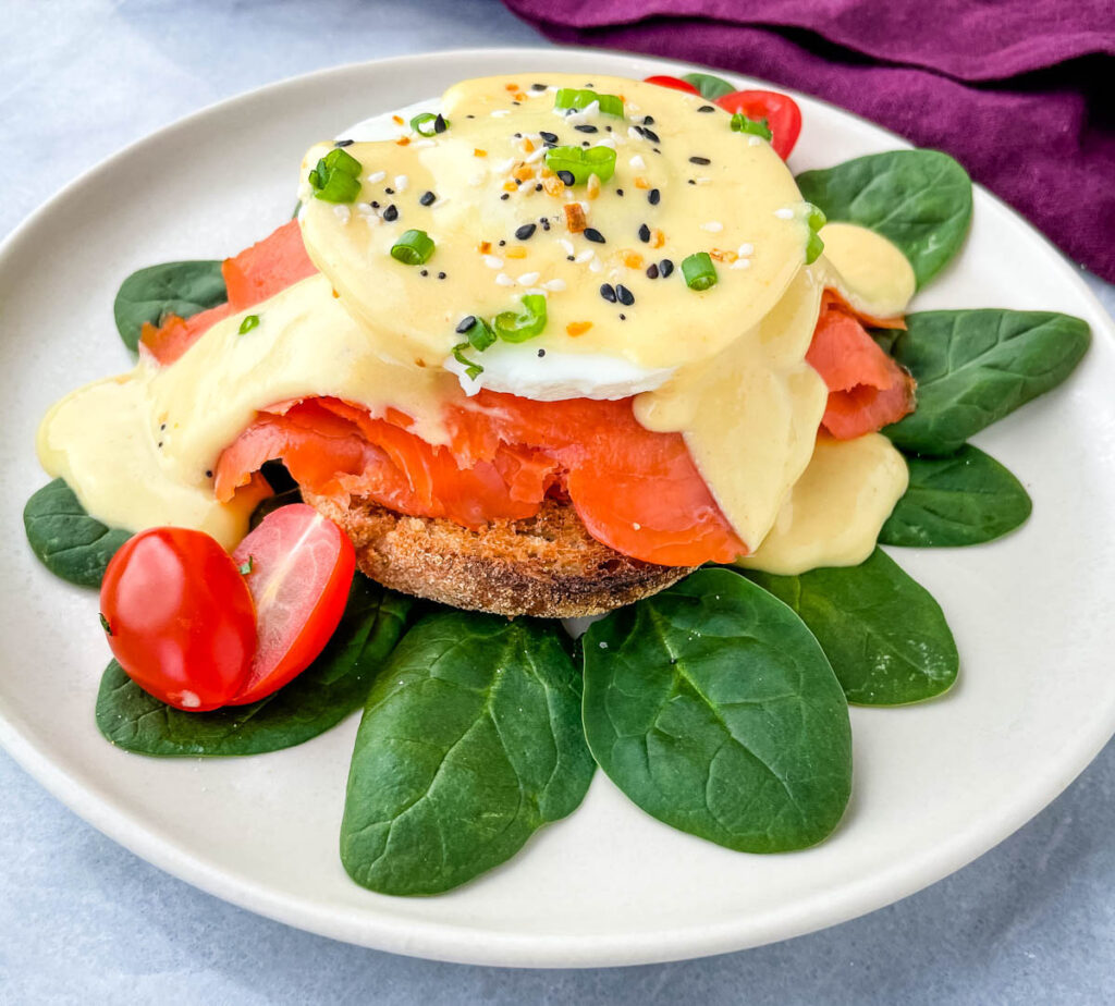 smoked salmon eggs Benedict on a bed of spinach