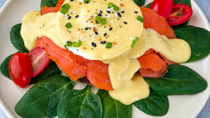 smoked salmon eggs Benedict on a bed of spinach