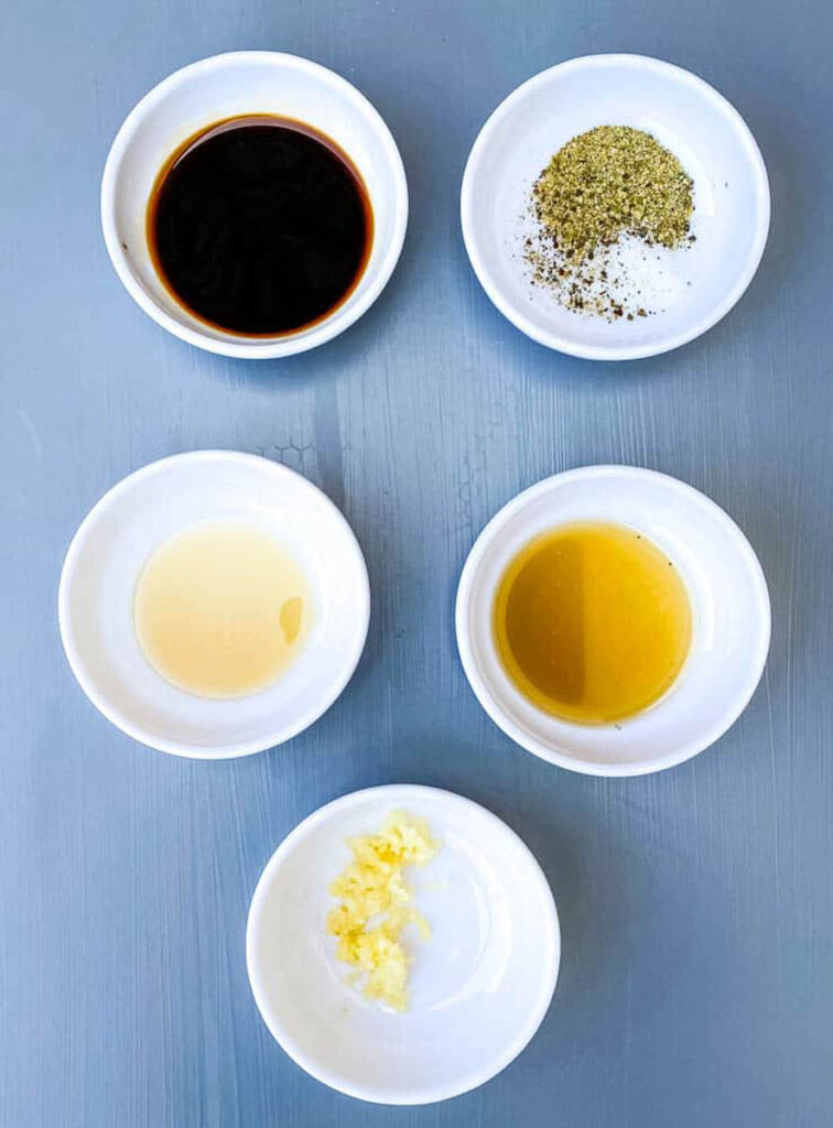 soy sauce, sesame oil, garlic, and ginger in separate bowls