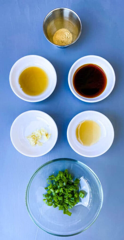 sesame oil, soy sauce, garlic, and green onions in separate bowls