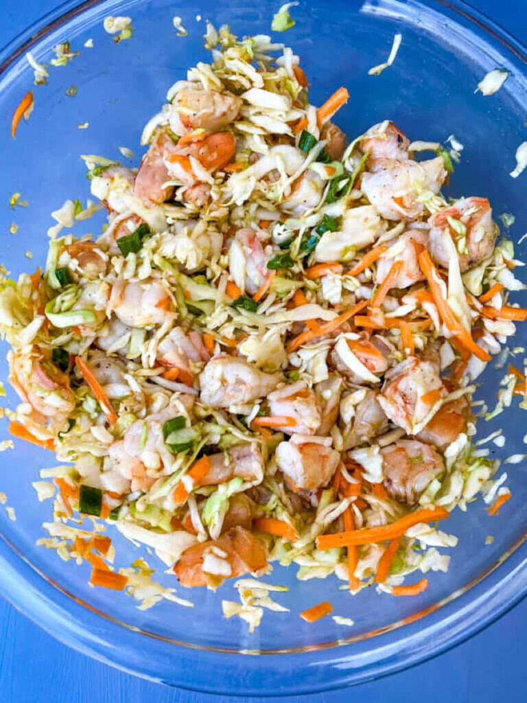 shrimp and cabbage egg roll mix in a glass bowl