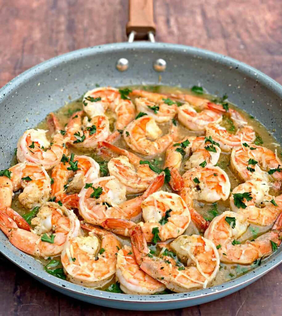 shrimp scampi without wine in a pan with parsley