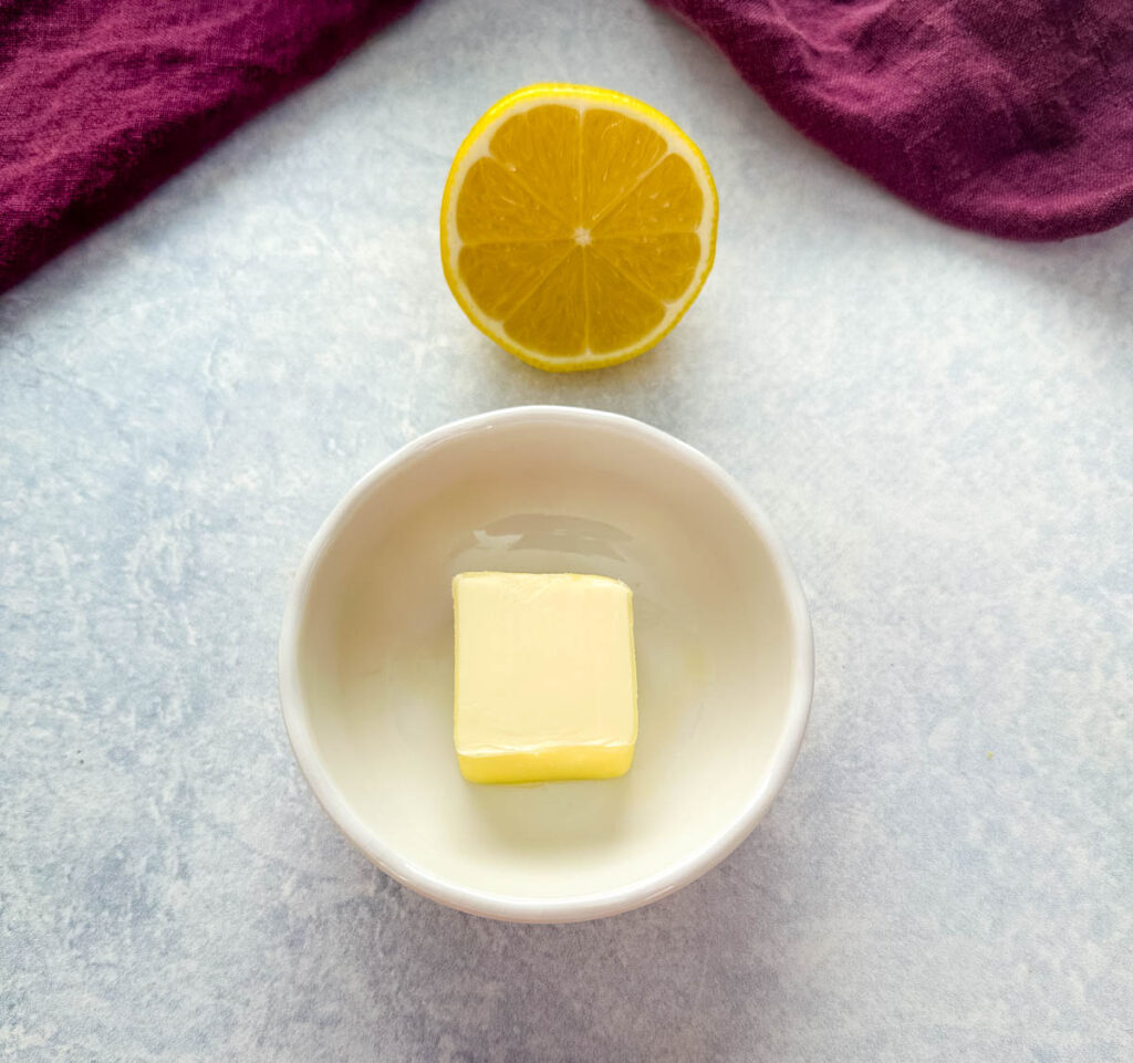 fresh lemon and butter on a flat surface