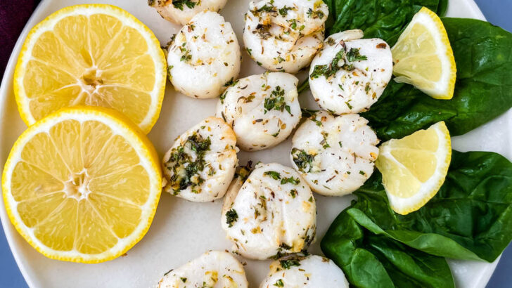 air fryer scallops on a plate with fresh lemon