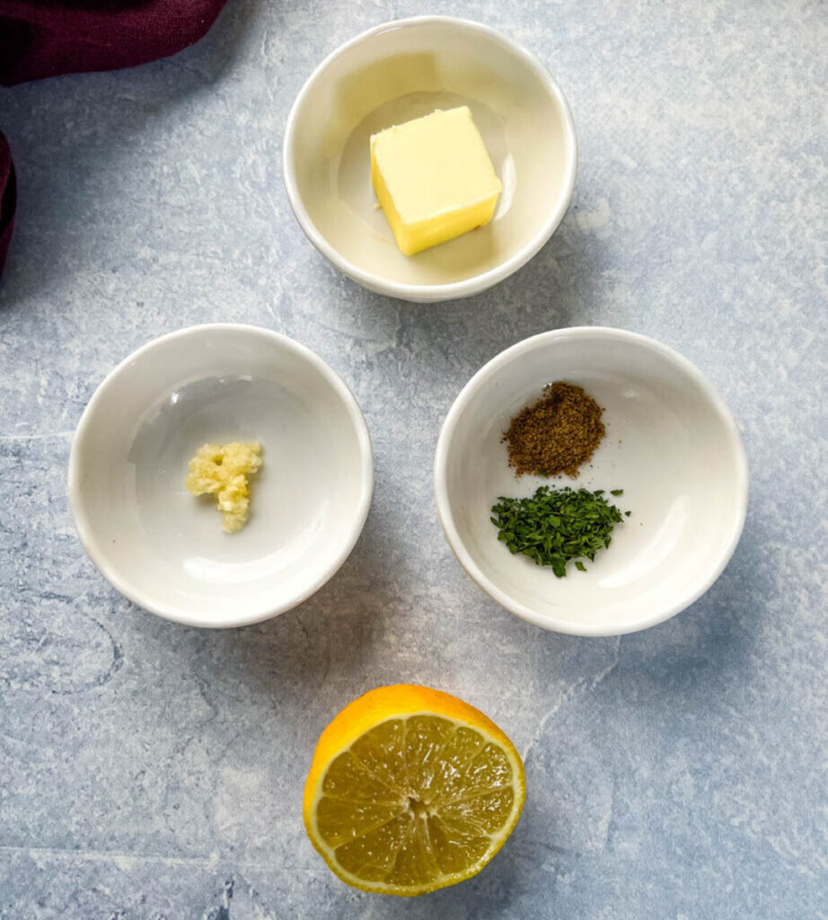 butter, garlic, spices, and lemon in separate bowls