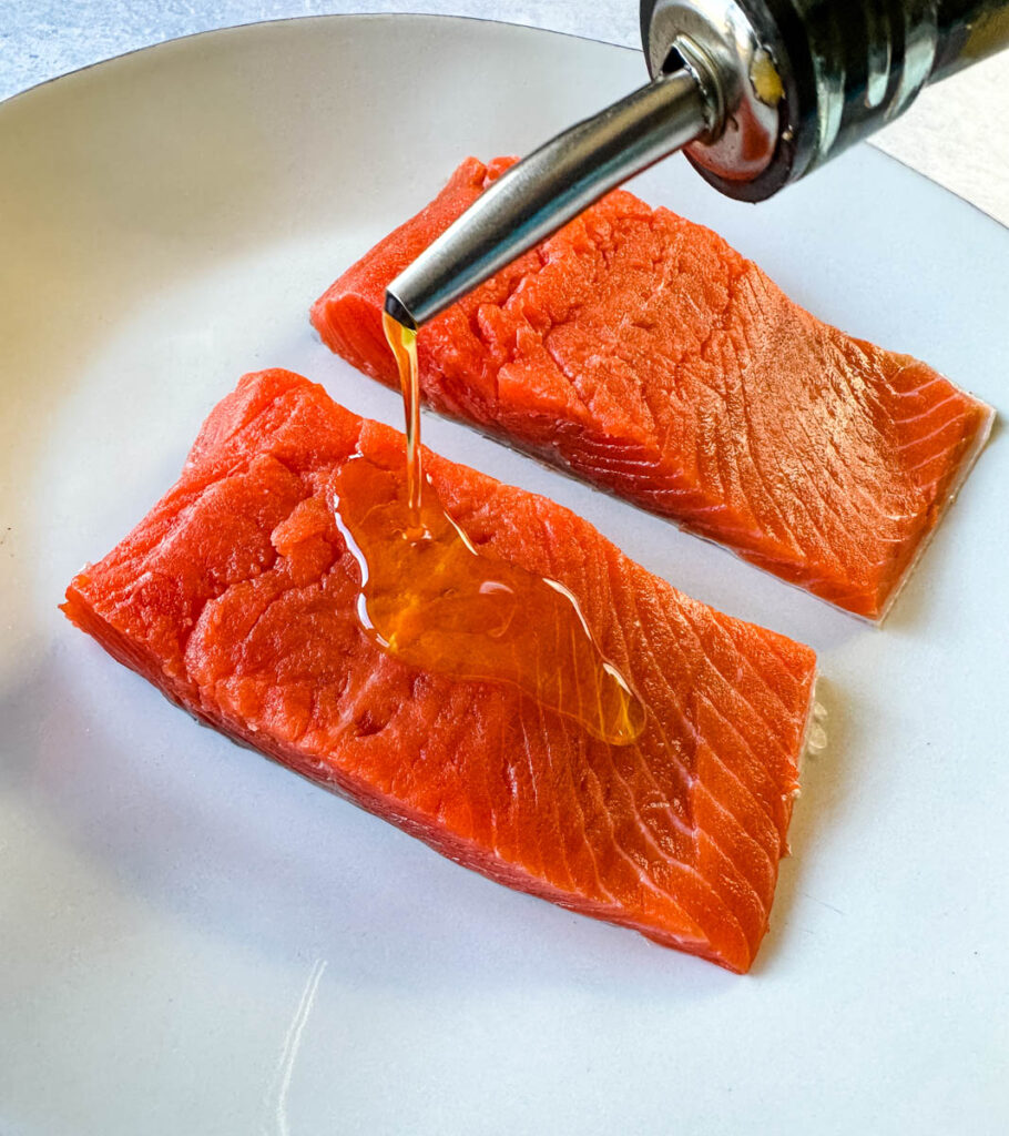 raw salmon drizzled with olive oil