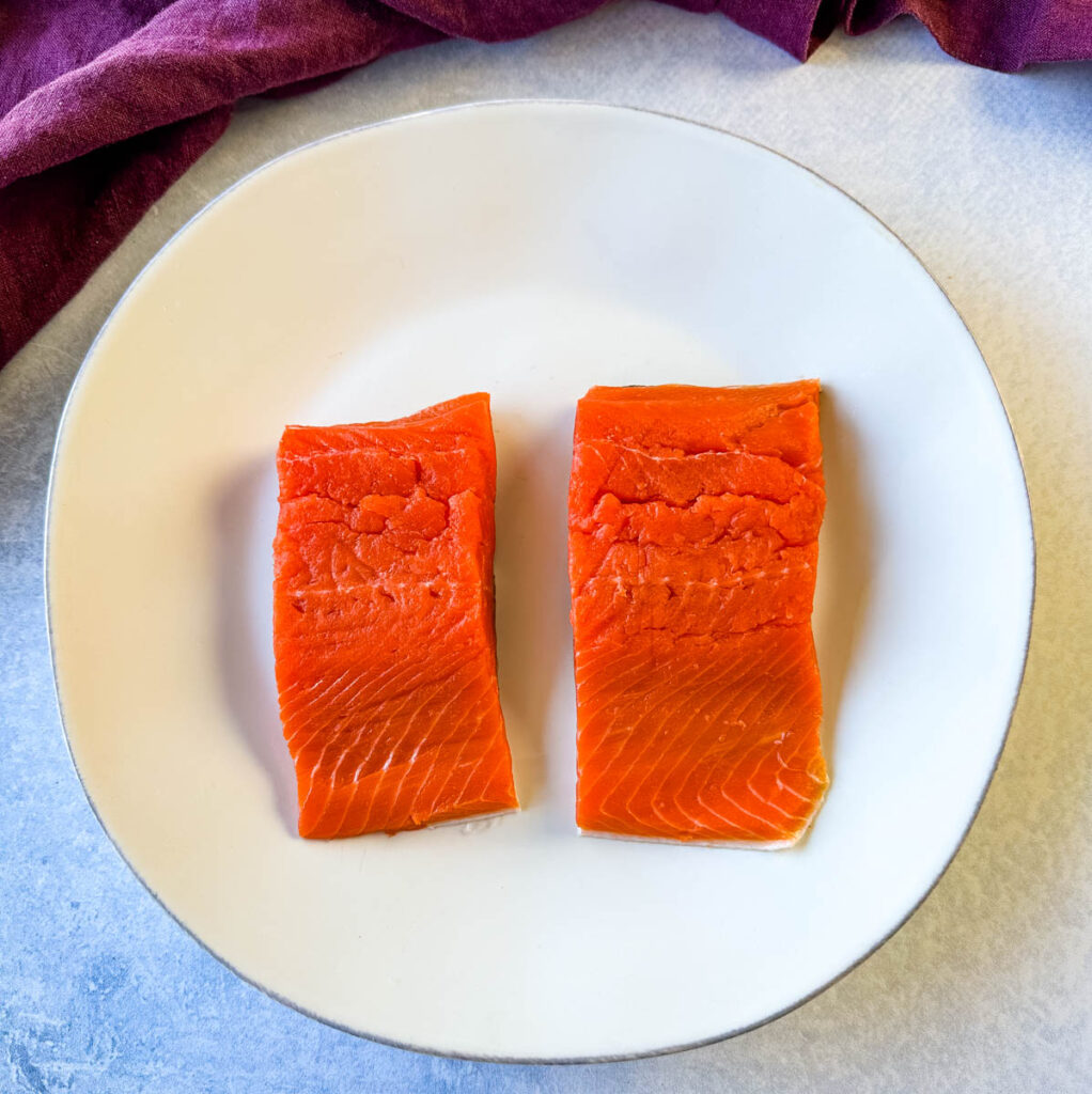 raw sliced salmon on a plate