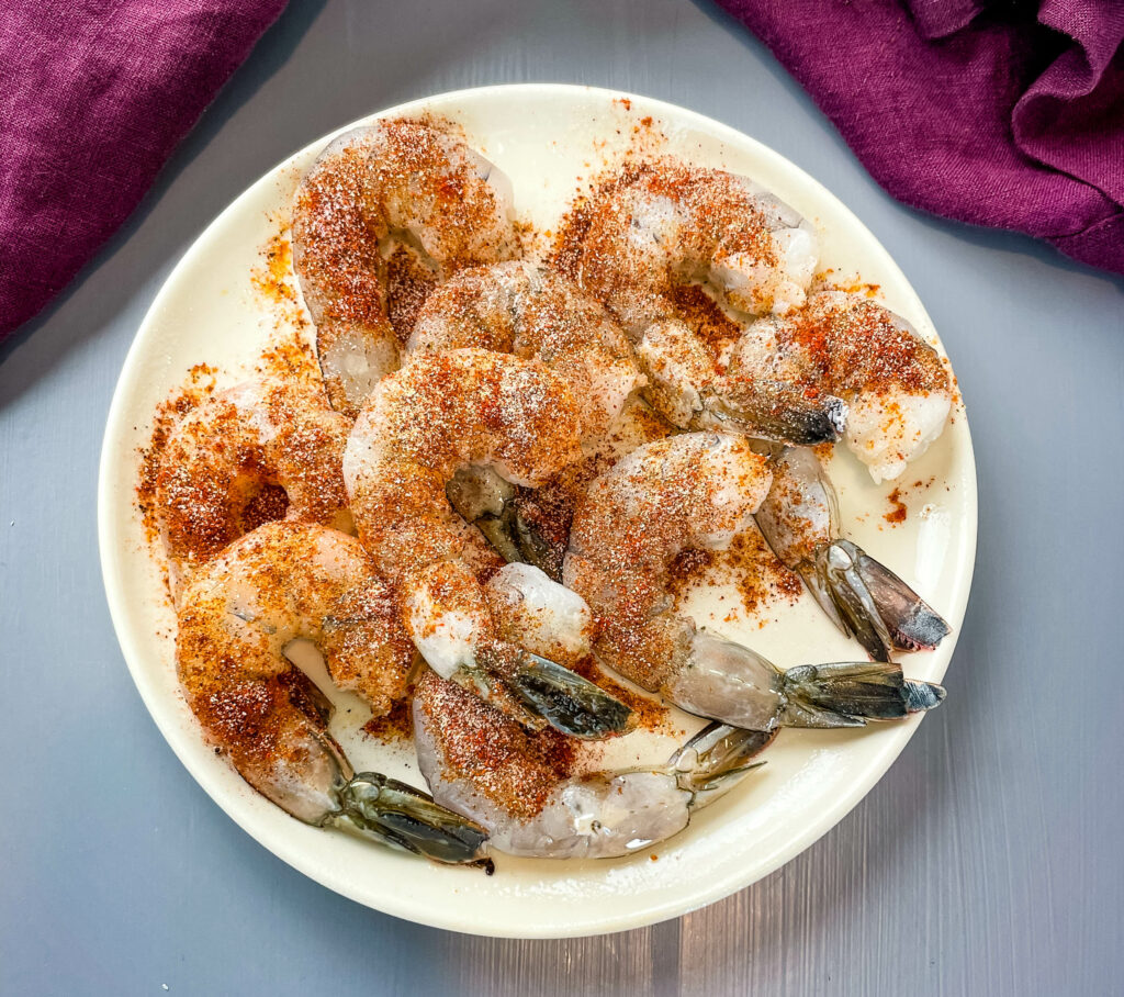 seasoned raw shrimp on a plate