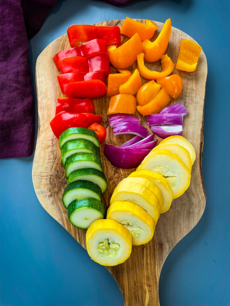fresh sliced vegetables sliced on a cutting board