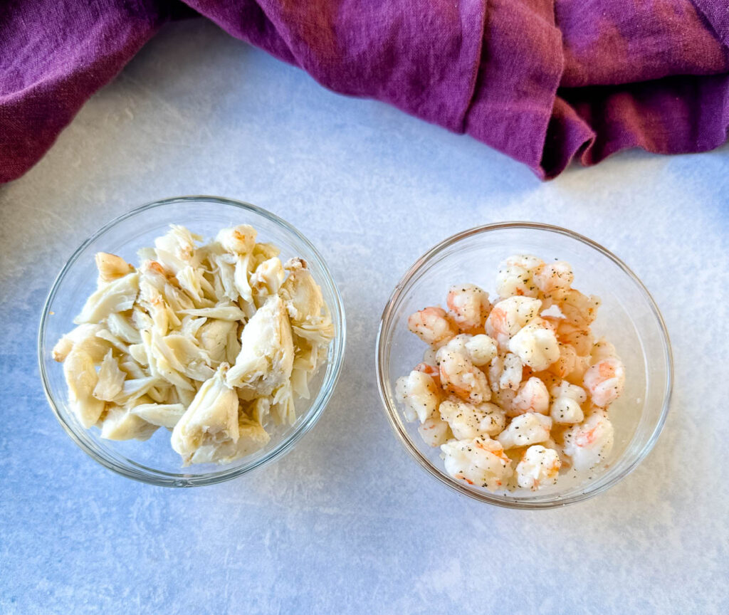 jumbo lump crab and cooked diced shrimp in separate glass bowls