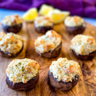seafood stuffed mushrooms with crab and shrimp on a flat surface
