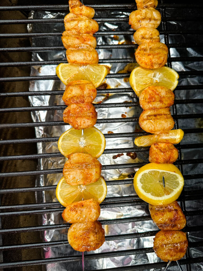 scallops and lemons on a skewer on a Traeger grill