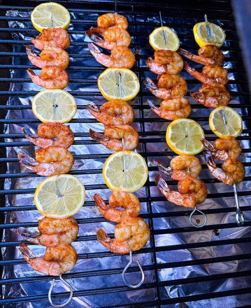 smoked shrimp on skewers with lemon on a Traeger smoker grill