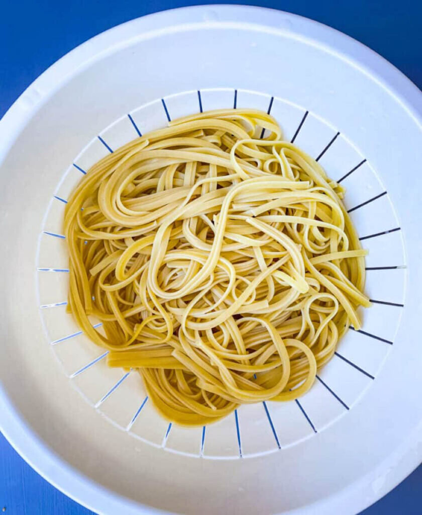 cooked linguine pasta in a colander