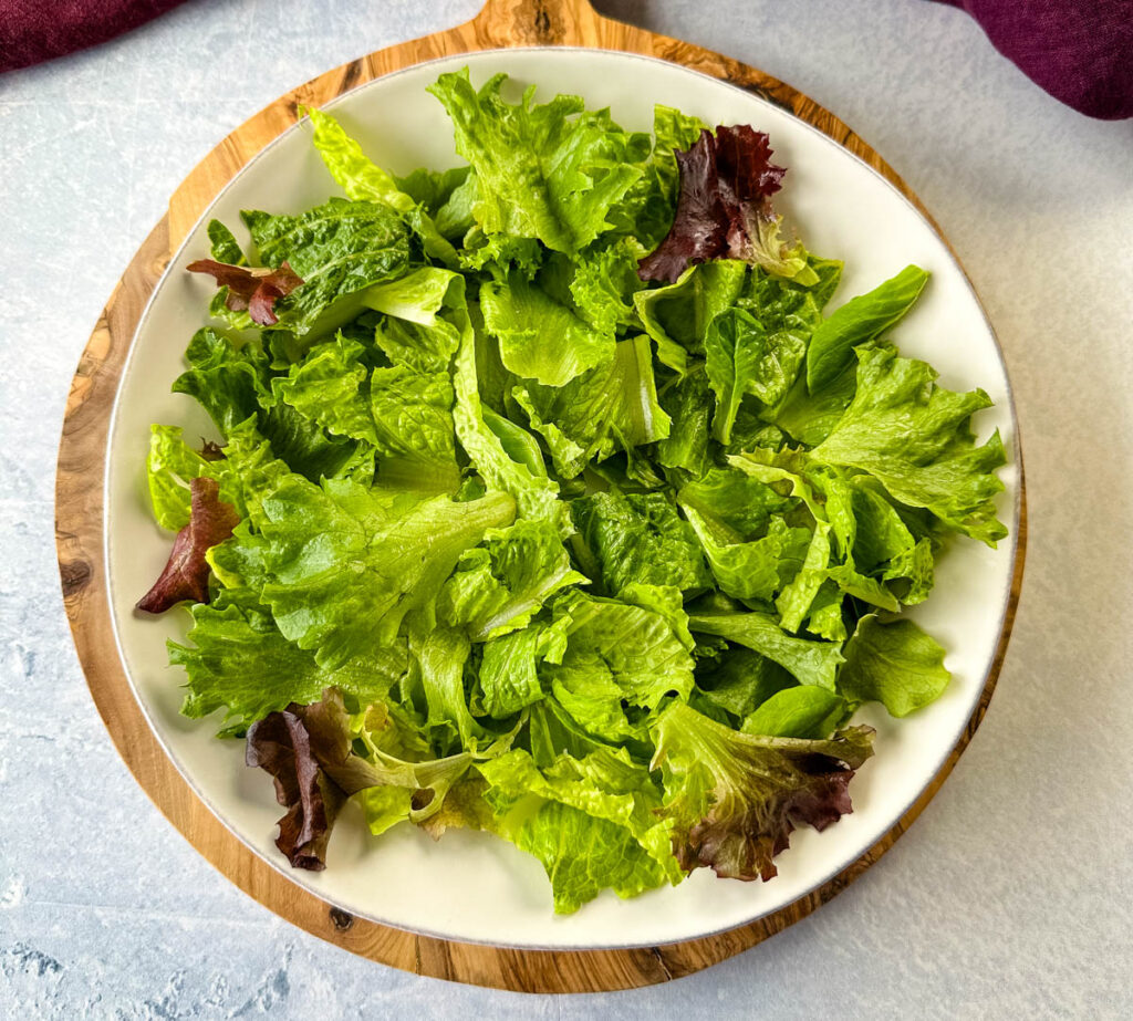 romaine lettuce and mixed greens on a plate