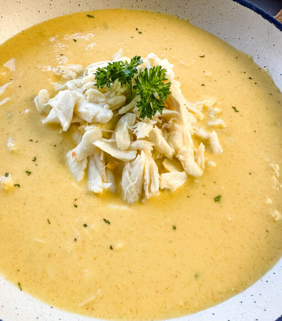 crab bisque in a white bowl with lump crab meat and flour
