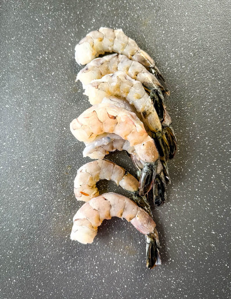 raw shrimp on a sheet pan