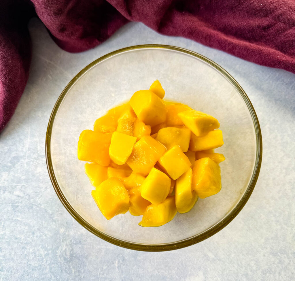 mango fruit in a glass bowl