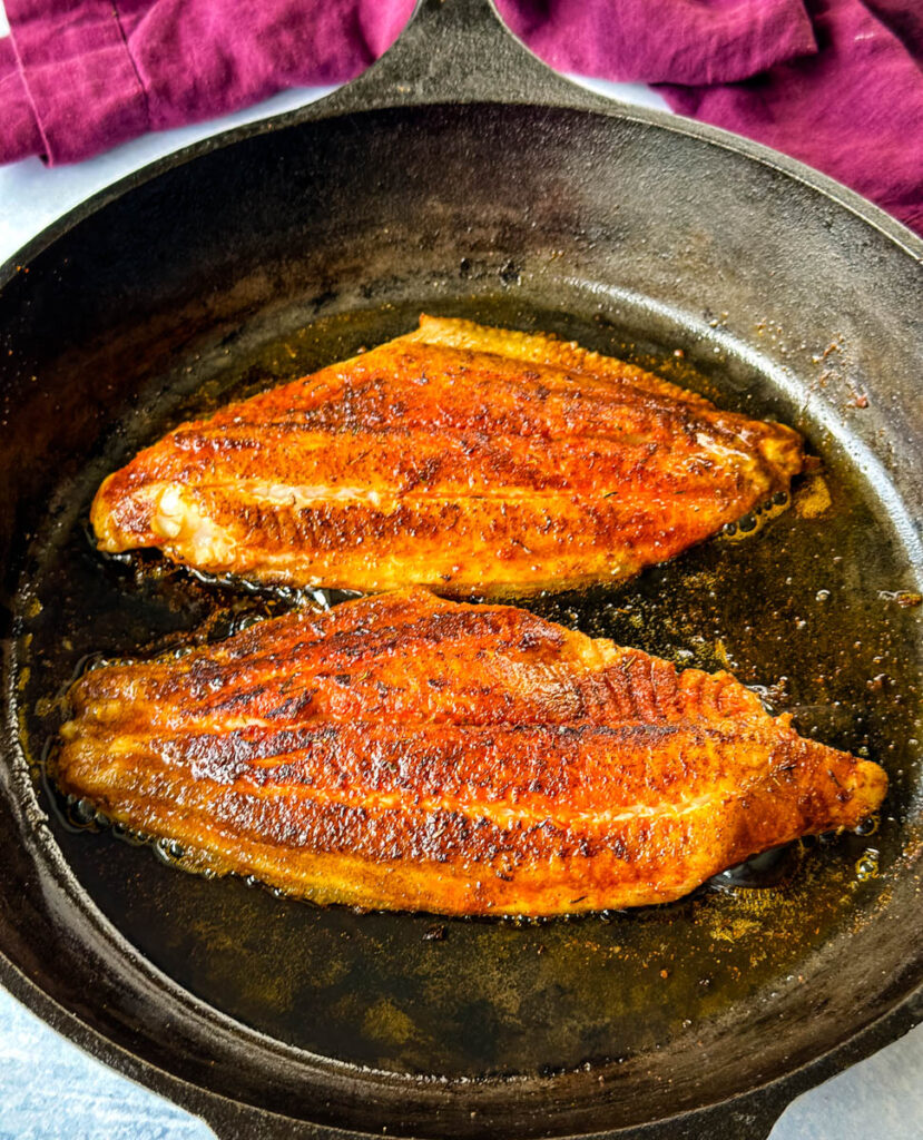 blackened catfish in a cast iron skillet