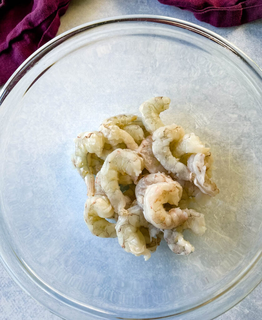 raw peeled and deveined shrimp in a glass bowl