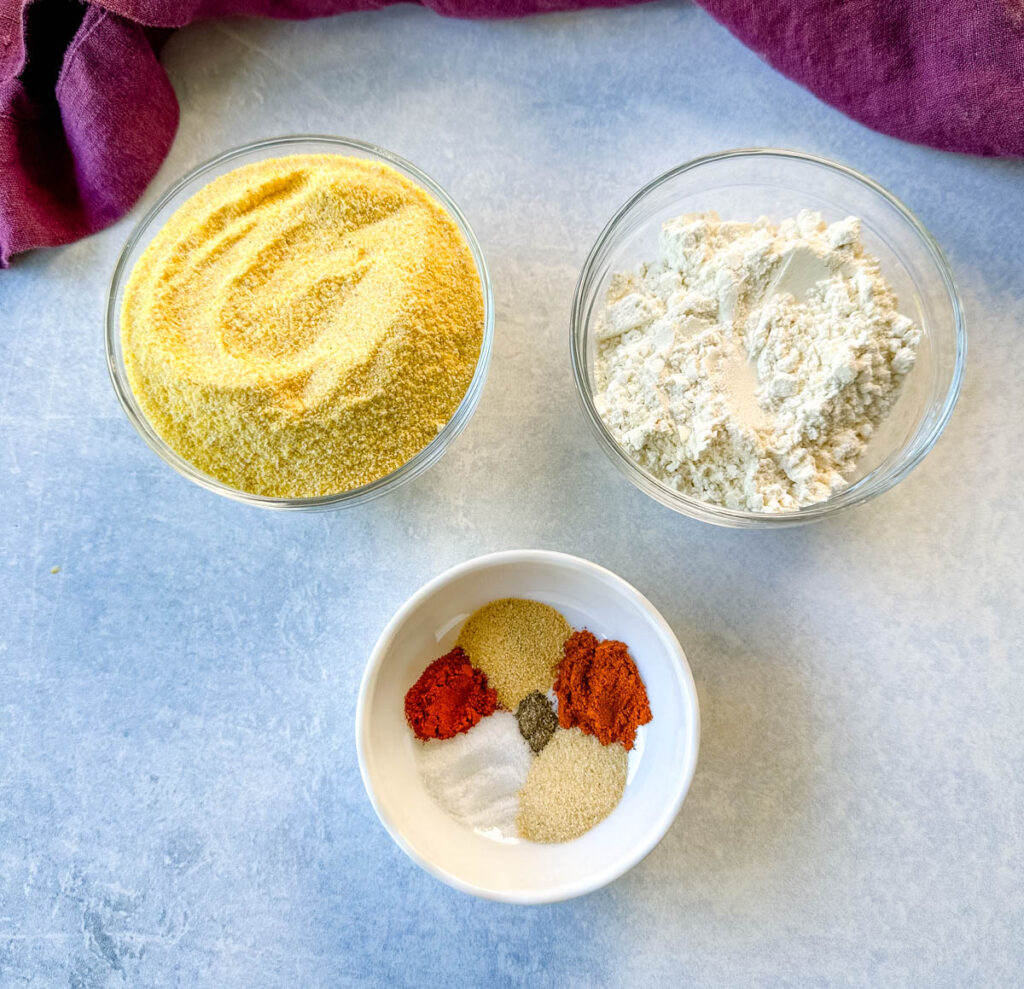 yellow cornmeal, all purpose flour, and spices in separate bowls
