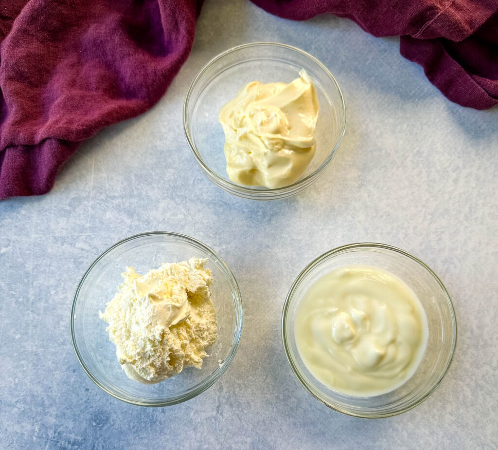 mayo, sour cream, and cream cheese in separate glass bowls