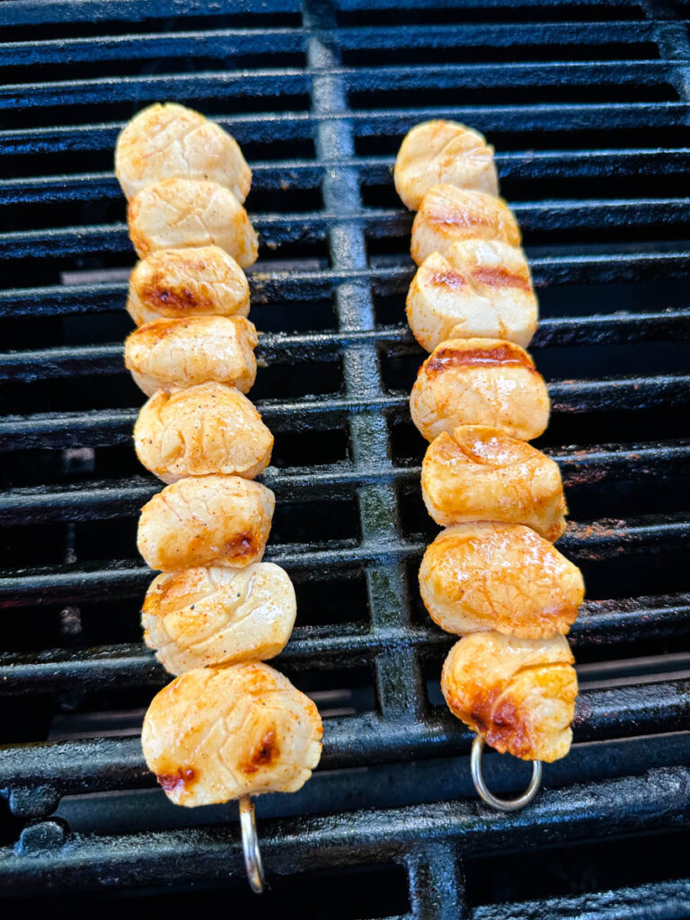 cooked scallops on a grill