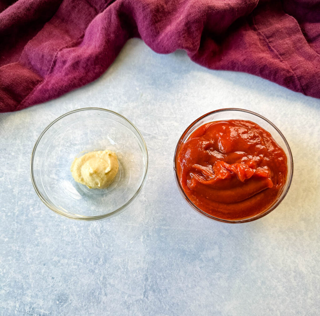horseradish sauce and ketchup in separate glass bowls