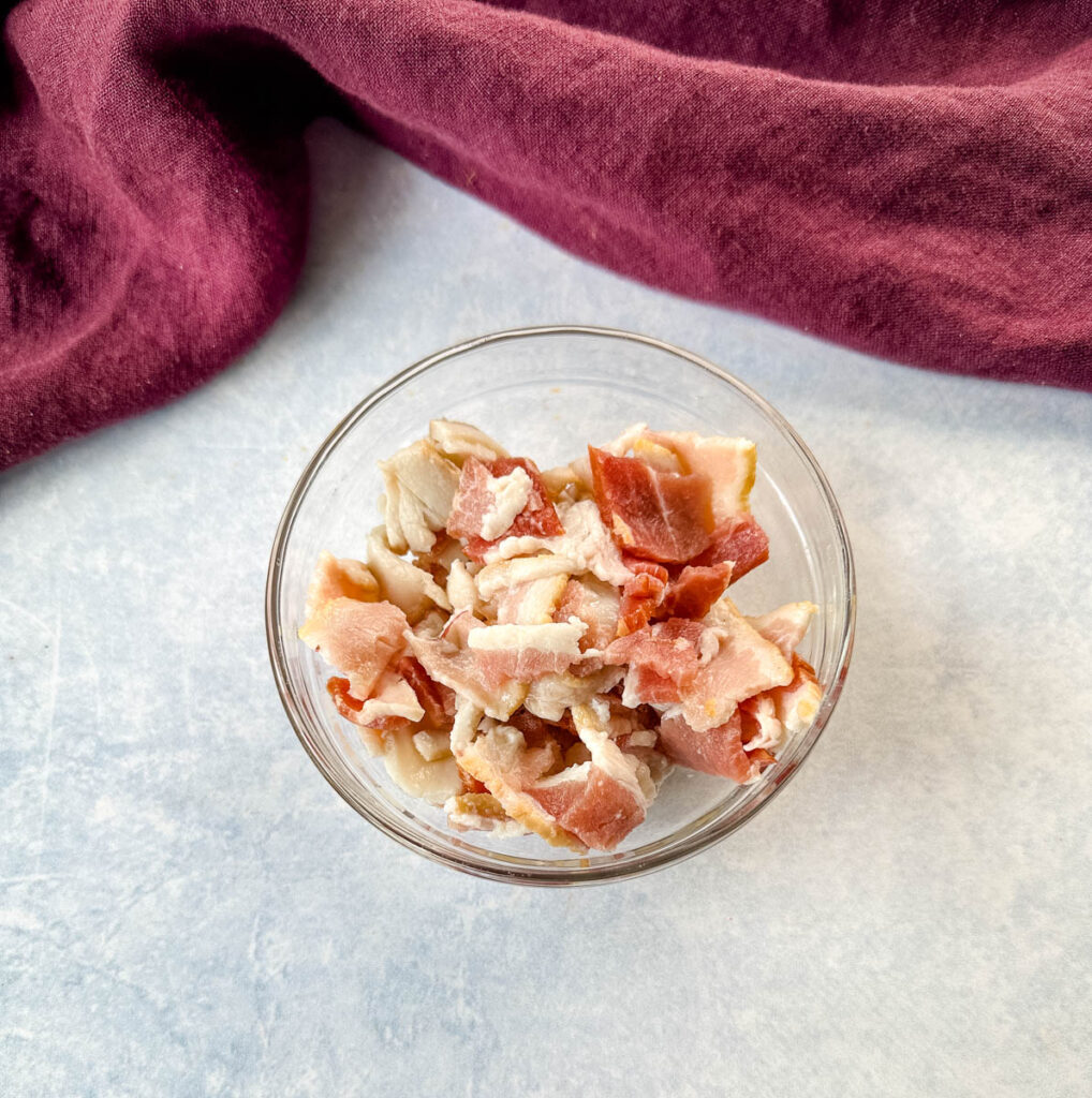 uncooked chopped bacon in a glass bowl