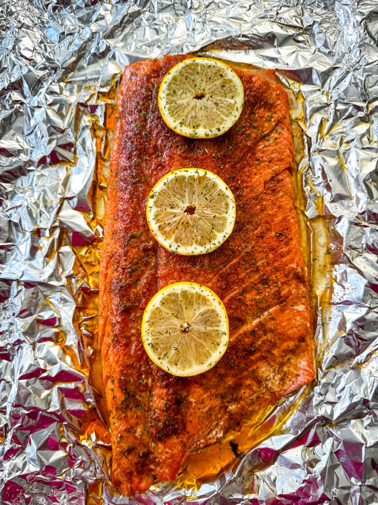 grilled salmon in foil with fresh lemons