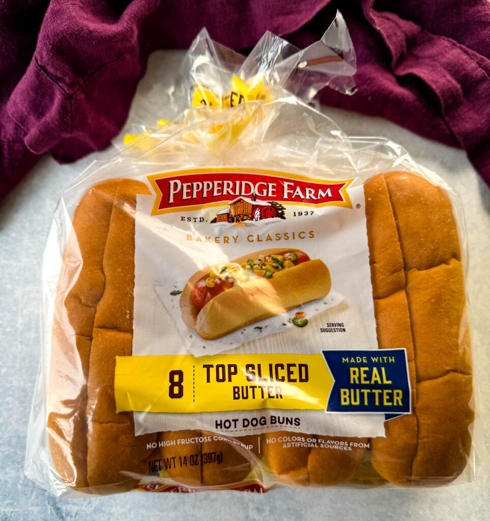 top sliced hot dog buns on a flat surface in packaging